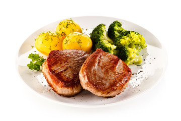 Grilled beefsteak with potatoes and broccoli on white background