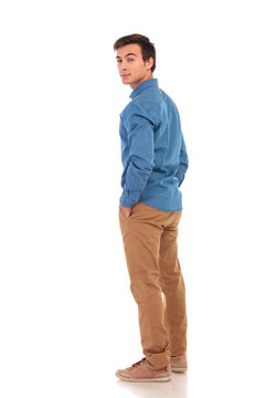 casual man looking back over his shoulder