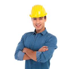 happy smiling construction engineer with hands crossed