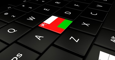 Close up of Oman flag button on laptop keyboard.