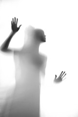 Silhouette of unknown women which wants to get behind fringe