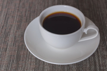 Fototapeta na wymiar Cup of coffee on the table.