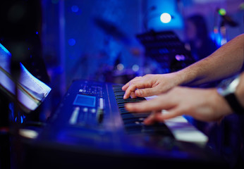 Closeup hands of pianist playing