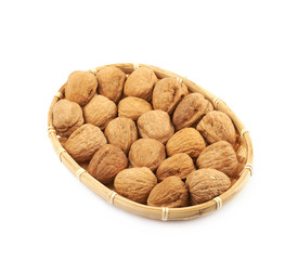 Wicker basket of walnuts isolated
