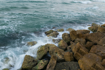 View of a rocky coast in the evening. Long exposure shot