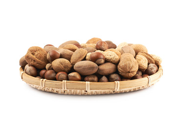 Wicker basket full of nuts isolated