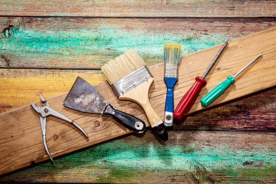 Tools for repair on a painted wooden table