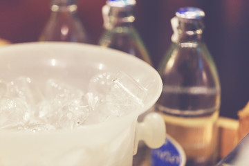 Ice cube in white bucket for the party.