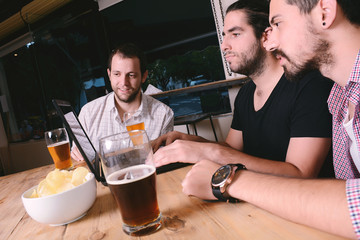 young friends having fun with laptop pc