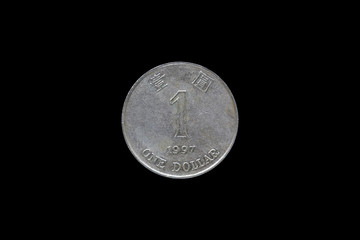 One dollar hongkong 1997 coin isolated on black background.