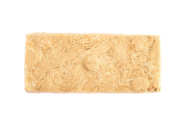 Briquette of nut halva confection isolated