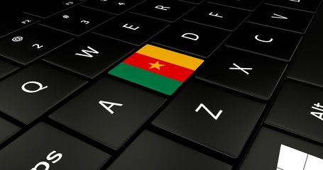 Close up of Cameroon flag button on laptop keyboard.