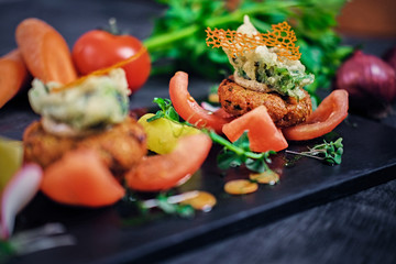 Seafood snacks with tomatoes.