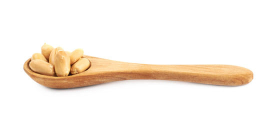 Spoon full of peanuts isolated