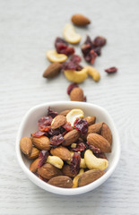 Healthy mix nuts on wooden background. Almonds, hazelnuts, cashews, peanuts, brazilian nuts