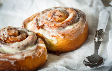 Homemade delicious cinnabon rolls with cinnamon and mascarpone frosting.