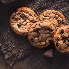 Chocolate chip cookies,  freshly baked on rustic wooden table. Selective Focus. Copy space.
