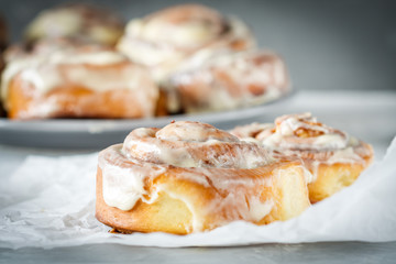 Homemade delicious cinnabon rolls with cinnamon and mascarpone frosting.
