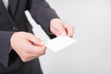 Business woman giving white business card