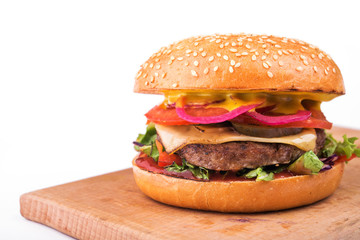 tasty hamburger with cutlet, tomato and cheese