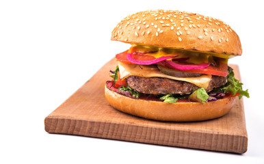 tasty hamburger with cutlet, tomato and cheese