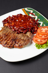 Pork steak with beans. Mexican food. Mexican cuisine.