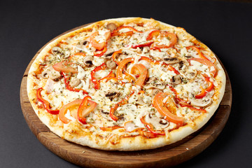 Hot pizza Con Fattoria on a rustic wooden table.