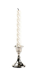 White candle in a candlestick isolated