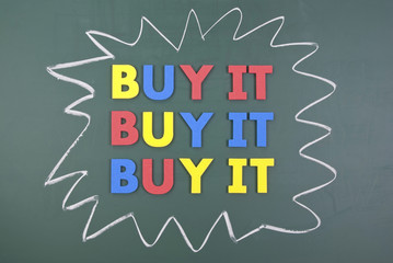 Buy it, colorful words on blackboard