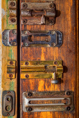 Door latches on wooden surface