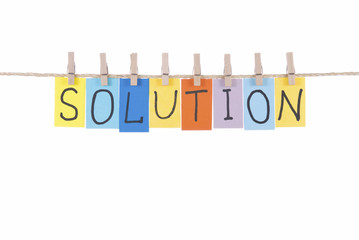 Solution, words hang by wooden peg