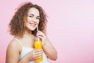 Beautiful woman drink fresh cold orange summer juice