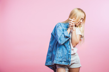 Portrait of beautiful blonde woman in jeans jacket smile