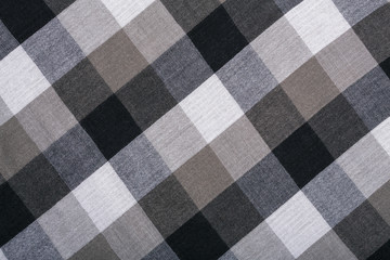 The texture of the cotton fabric. The fabric in black and white squares. The structure of the fabric. Fashion. Style. Square pattern. The pattern for textiles. Fashion Design and House Interior Design