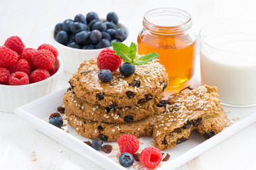 oatmeal cookies, milk and berries for a healthy breakfast