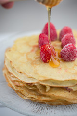 Pancake with raspberry and honey