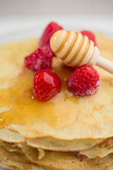 Pancake with raspberry and honey