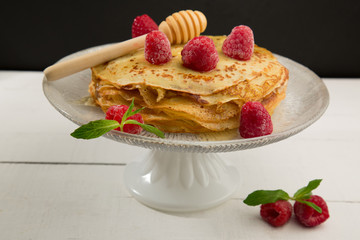 Pancake with raspberry and honey