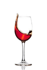 Classic Glass of Red Wine isolated on a white background. Splashing red wine in a glass. A splash of red wine in a glass. Grapes. Alcohol.