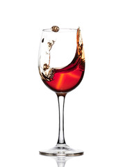 Classic Glass of Red Wine isolated on a white background. Splashing red wine in a glass. A splash of red wine in a glass. Grapes. Alcohol.