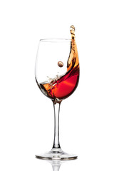 Classic Glass of Red Wine isolated on a white background. Splashing red wine in a glass. A splash of red wine in a glass. Grapes. Alcohol.