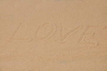 Love message written in sand, Word love on sand