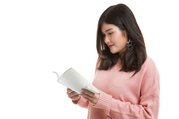 Young Asian woman read a book.