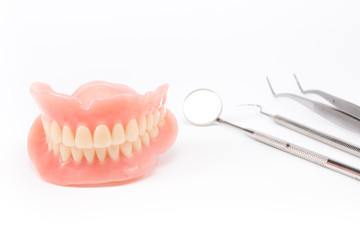 teeth and dental mirror, symbol photo of dentures, diagnosis and copayment