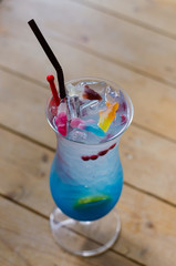 Blue Italian Soda, Signature Mocktail drink birthday party, with rabbit soft plush on the table.