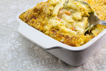 Macaroni with cheese and tomato close up