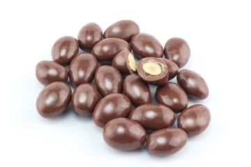 Chocolate covered nut balls in a group isolated on white background - closeup