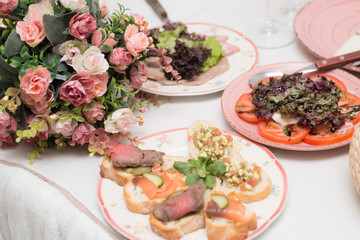 Festive table with snacks and flowers