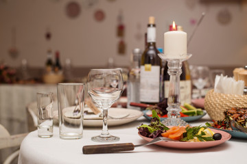 Festive table with snacks and flowers