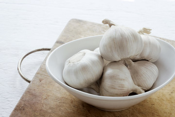 Garlic. Garlic Cloves and Garlic Bulb in bowl.
